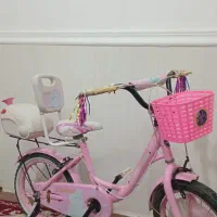 دوچرخه۱۶ صورتی خوش رنگ در حد نو با تمام امکانات