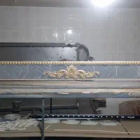 تاج وکتیبه پرده