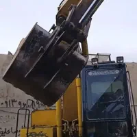 راننده بیل مکانیکی لاستیکی هستم