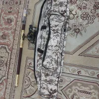 لانسر با کیف و چوب