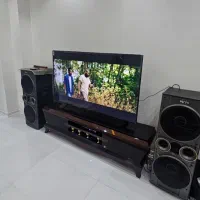 تلویزیون ۶۵ سونی با میز و اسپیکر