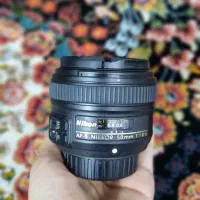 لنز نیکون f/1.8G.  50mm اتوفوکوس