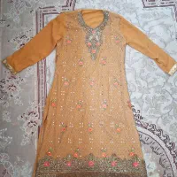 ست کُرتا شلوار ژرژت گلدوزی‌شده نارنجی طلایی