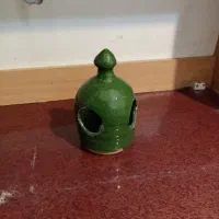 قفس و آبخوری و دان پرنده