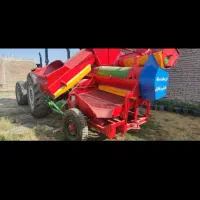 کوبیدن آفتاب گردان با دستگاه در محل
