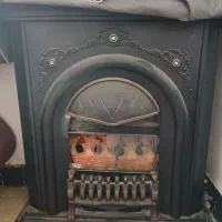 بخاری طرح شومینه و ساعت دیواری