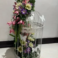 قفس دکوری گل آرایی شده‌