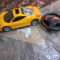 ماشین کنترلی زرد و خوشگل همراه کنترل اصلی