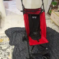 کالسکه مسافرتی سالم کم جا به رنگ قرمز ومشکی