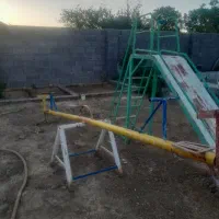 یدونه سرسره یک عدد الا کلنگ دو عدد میز باغ