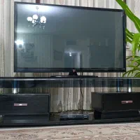 میز تلویزیون چوب شیشه ‌ در حد نو
