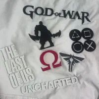 چند عدد قطعه فلزی با لوگوی گیمینگ