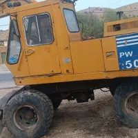 بیل مکانیکی کوماتسو لاستیکی 100