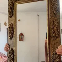 آیینه بزرگ و قفس پرنده