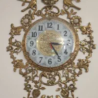 ساعت برنجی و لوستر برنجی