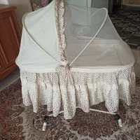گهواره ی بچه دوحالته چرخ دار