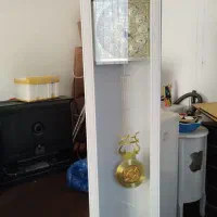 ساعت ایستاده و میز تلفن