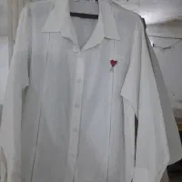 چرخکار وسط کار در کارگاه زنجیره ای مانتو شومیز