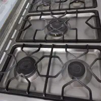 اجاق گاز ۵شعله اسنوا و یخچال فریزر ارج