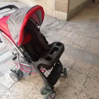 کالسکه خیلی تمیز مارک بیبی کو با دسته دو طرف