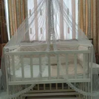 گهواره کنار تخت مادر