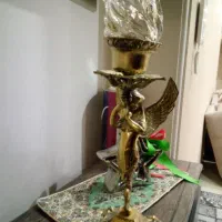 مجسمه برنجی چراغ دار