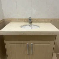 روشویی کابین دار همراه با شیر