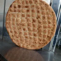 فروشنده و خمیگیر برای نانوایی بربری