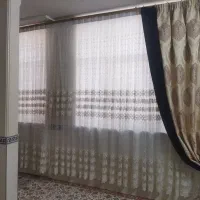 پرده پلیسه همراه با والان