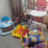 لوازم کودک شامل روروئک کالسکه صندلی غذا و