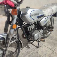 ax 100 سوزوکی