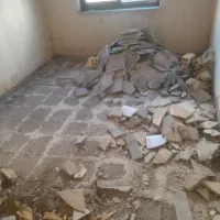 تخریب ساختمان  جمع آوری در گونی حمل نیسان کمپرسی