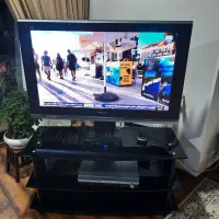 تلویزیون ۴۲ پاناسونیک اصل با میز شیشه‌ای ترکیه ای