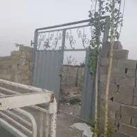 باغچه-چهاردیوار-با-درب-ماشین-رو