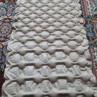 توشک بادی و پوشا‌ک