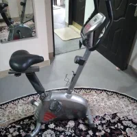 دوچرخه ثابت و اتو بخار ایستاده