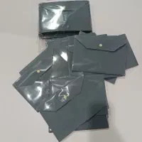 تعدادی پوشه دکمه دار A5 نو و پلمپ