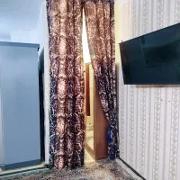 دستک پرده ساتن براق گلدار سرمه ای