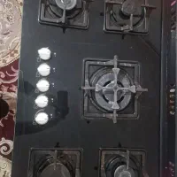اجاق گاز سفید رنگ صفحه شیشه ای طرح فر