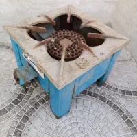 اجاق گاز .جاقابلمه ای.چوب لباسی پایه دار.گل ذرتی