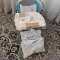 کریر و سری خواب نوزاد با یک قنداق پیچ بچه