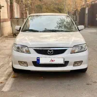 مزدا 323 اتوماتیک سفید مدل 1385