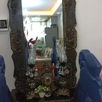 آینه قدی با ساعت و شمعدان لاله ای که روشن میشود