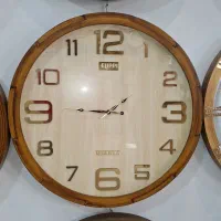 ساعت چوبی قاب کنده کاری شده