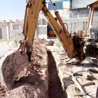 بیل بکهو کمپرسور کاتر پیکور بالابر ساختمانی