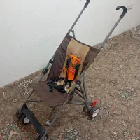 کالسکه  خارجی مارک جونیور سالم با یه صندلی غذا