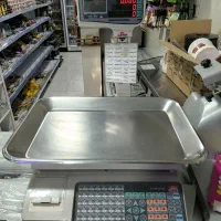 ترازو و کالباس و صندوق فروشگاهی