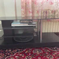 میز تلویزیون چوب و شیشه چرخ دار