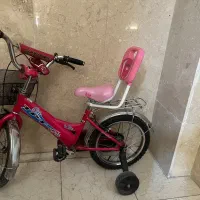 دوچرخه سایز ۱۲ در حد نو با لوازم اضافی