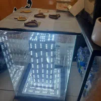 میز شیشه ای چرخ دار